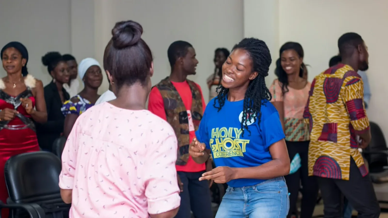 Members of the congregation dancing in worship
