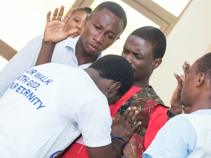 Members of the congregation praying together
