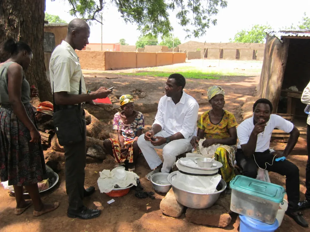 Ministry team sitting with residents during the Builsa North outreach