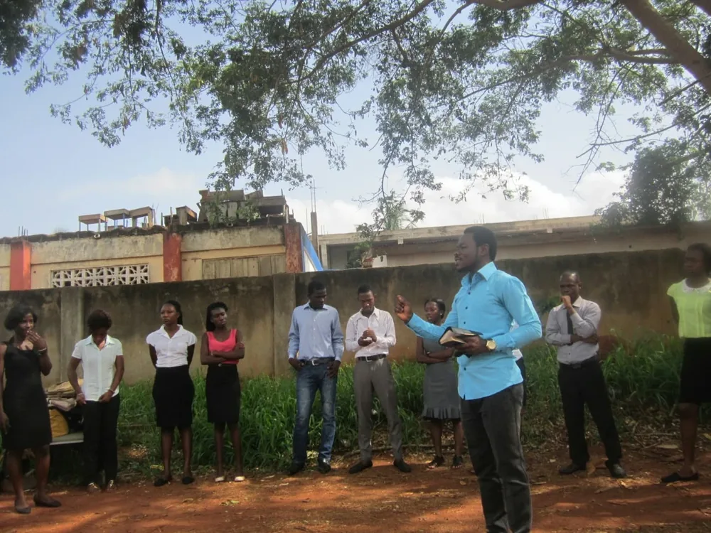 Prophet AK Lawrence teaching an open-air gathering of students