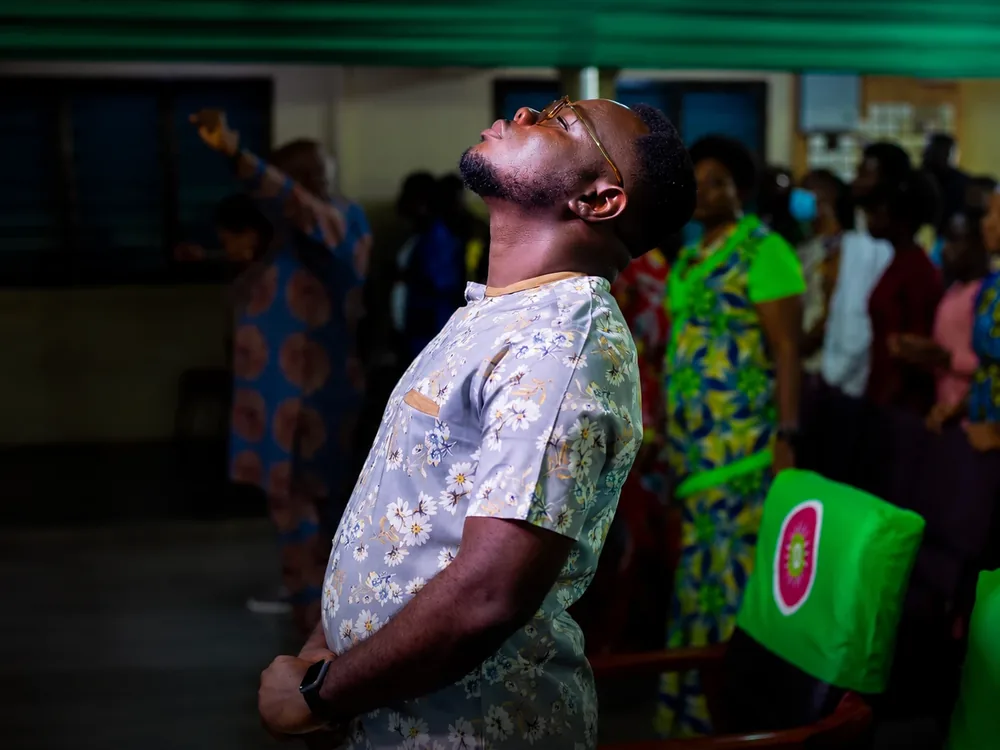 Prophet AK Lawrence in worship during a service