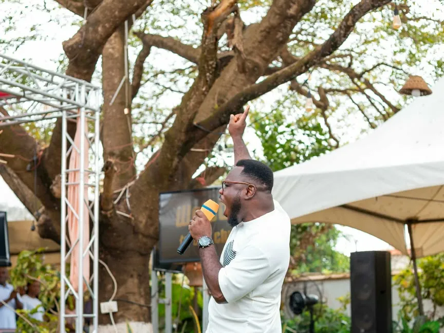 Prophet AK Lawrence preaching at an open-air gathering
